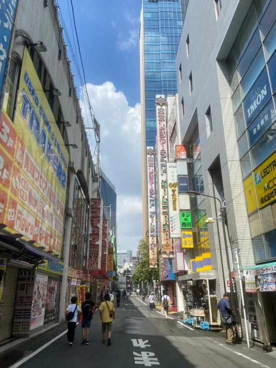 a street filled with people and tall buildings