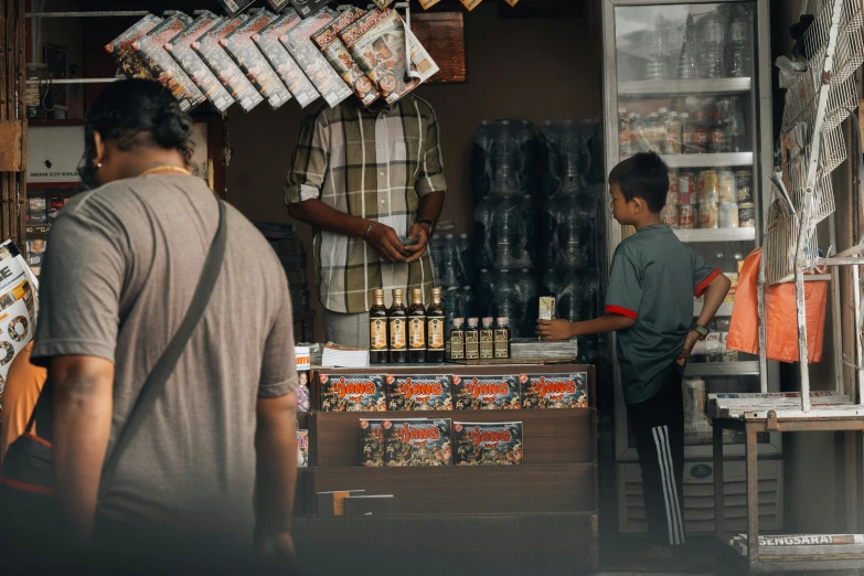 people are shopping in a retail area at the market