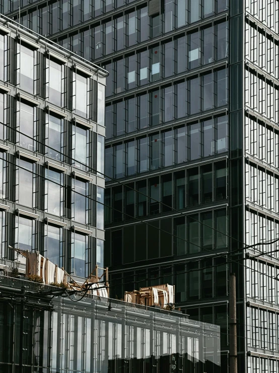 two buildings near each other with a crane on top