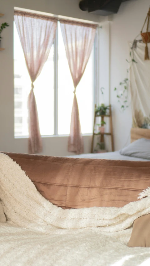 a blanket is folded on top of an open bed