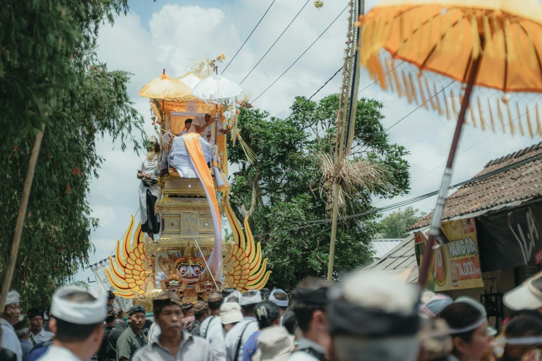 an oriental float is adorned with gold and decorations