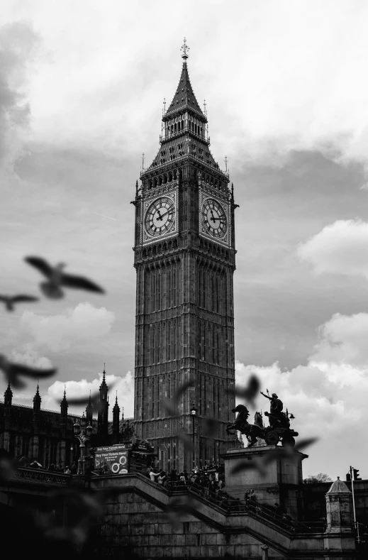 a tower clock with a white clock at the top