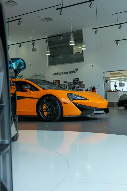 a car that is sitting in a showroom