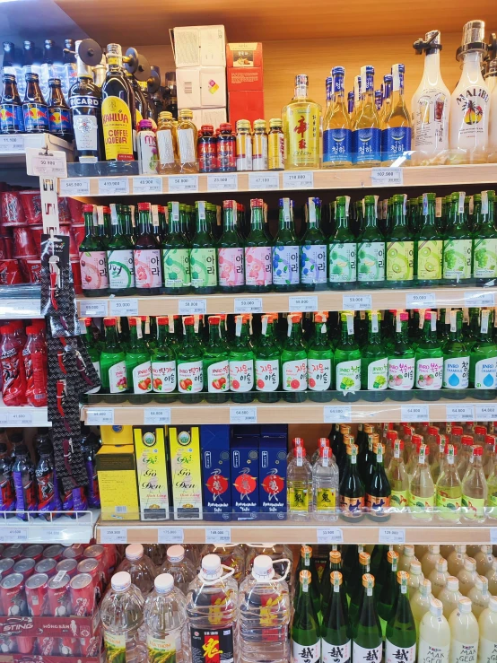 a supermarket shelf filled with alcohol bottles