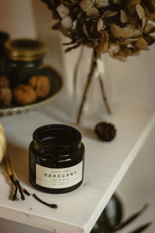 a small jar of marquay on a counter
