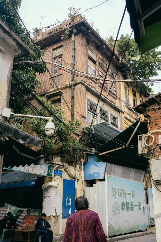 a man walking in front of a building