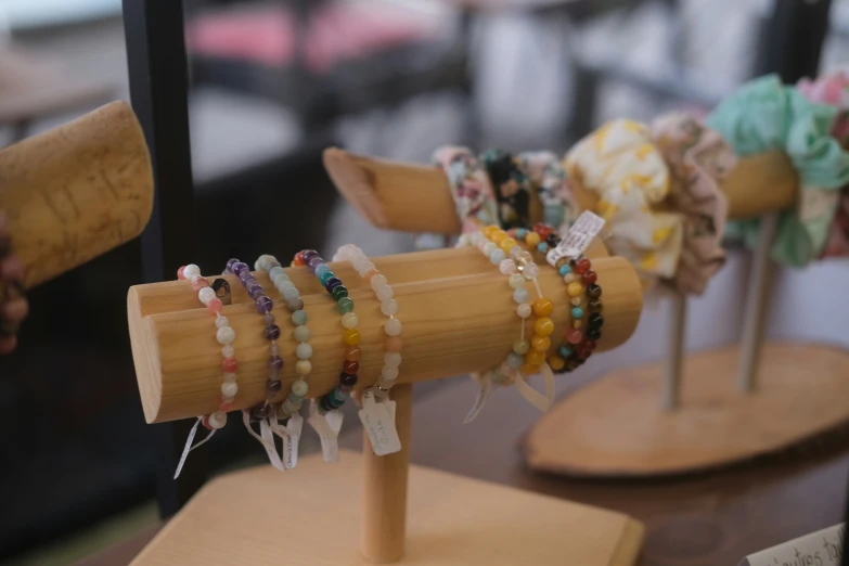 a close up of wooden items with jewelry on it