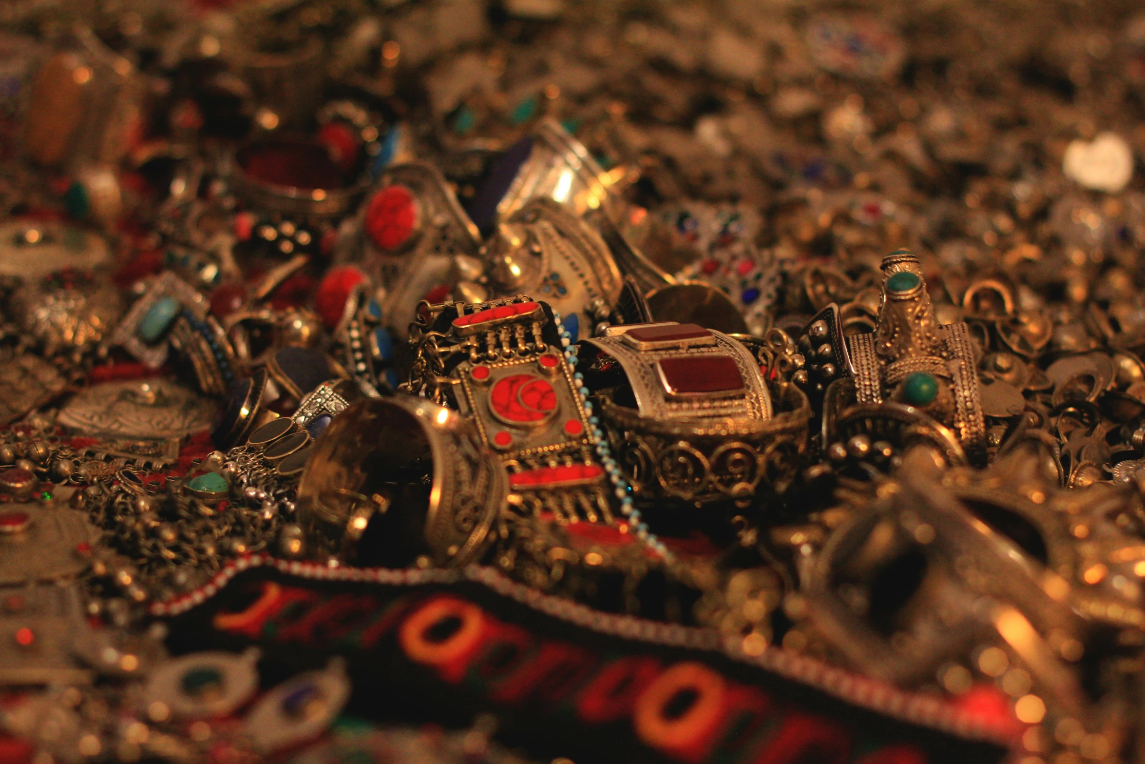 an old pile of jewelry including a bunch of rings