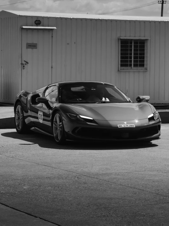 black and white pograph of a very modern sports car