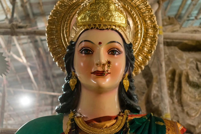 statue of goddess of destruction and gold jewelry