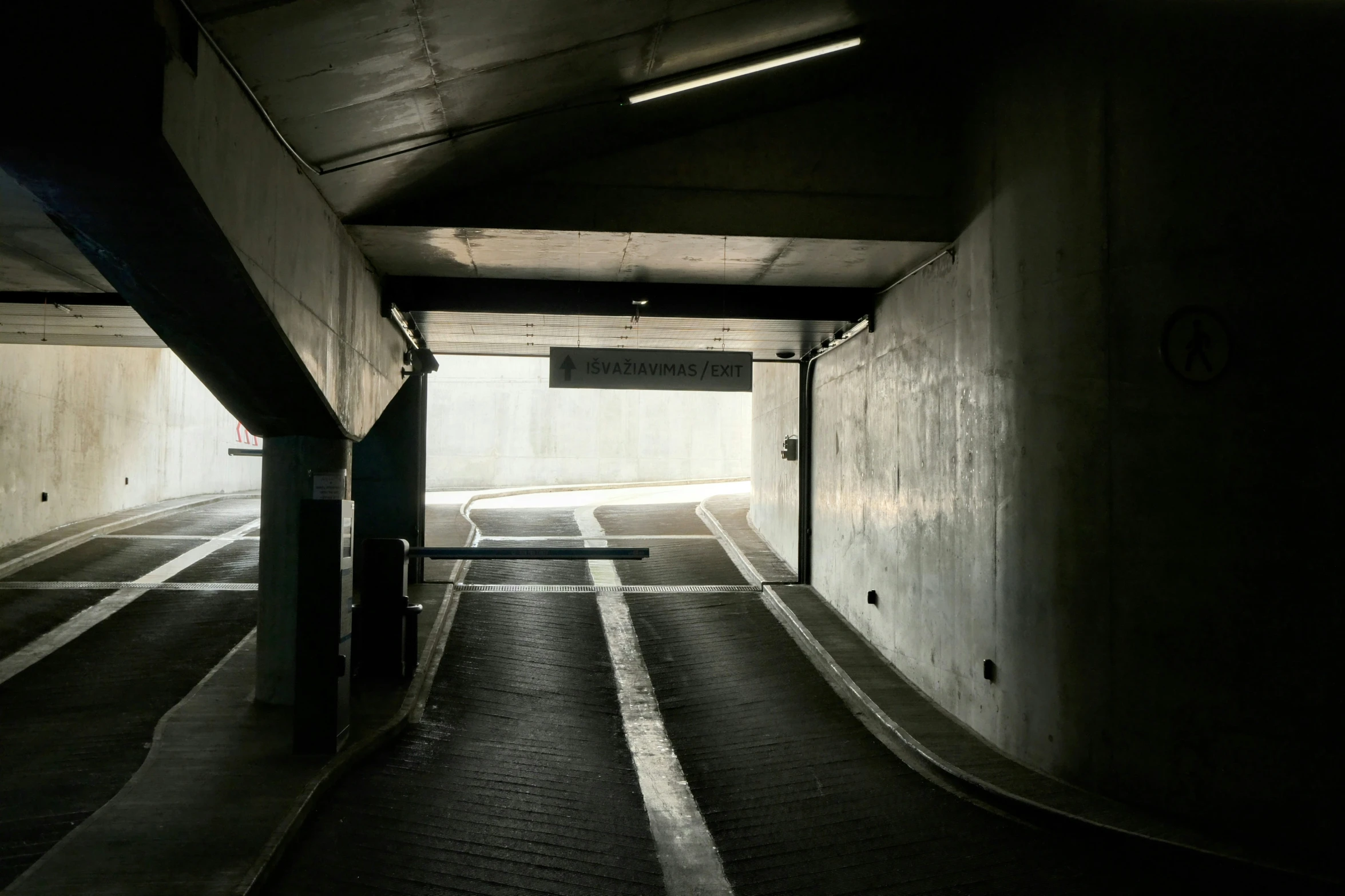 an image of a tunnel with some cars parked