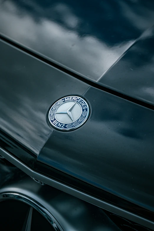 an emblem on a black car in a close up image