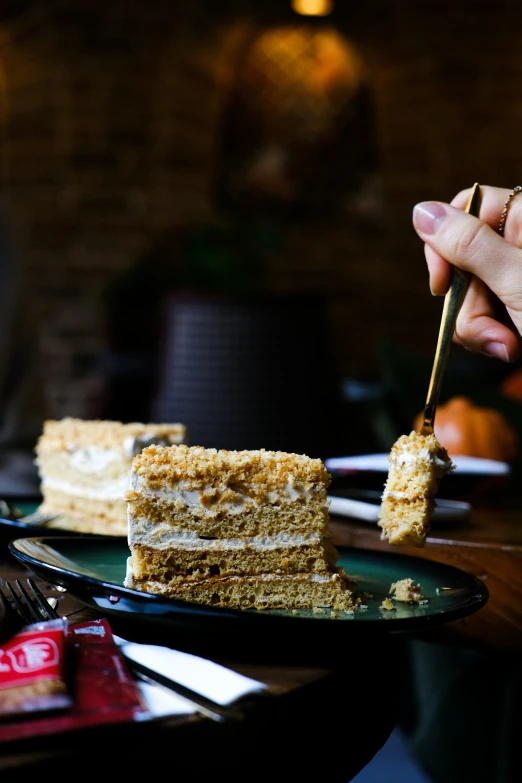 a close up of a person eating cake