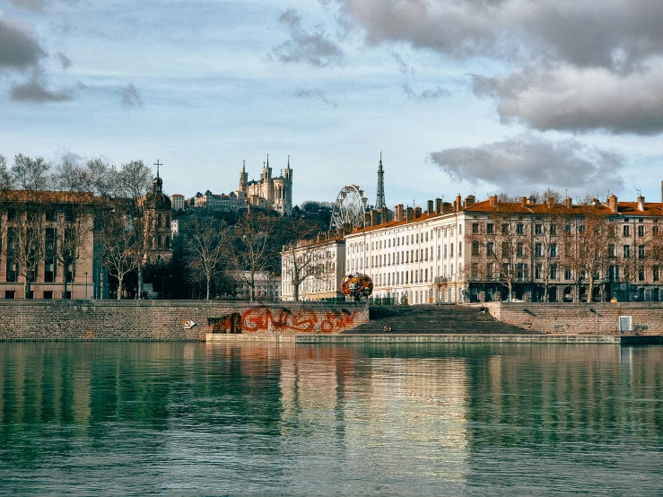 a large body of water with a bunch of buildings on the side