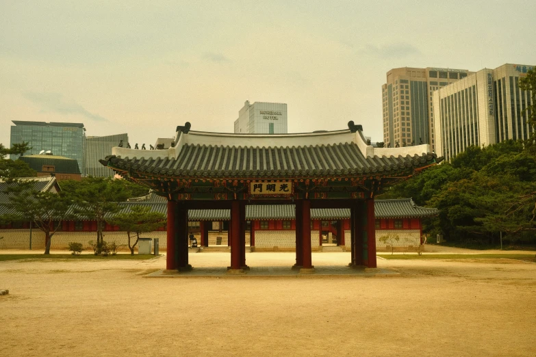 the asian pavilion stands in a square, surrounded by large buildings