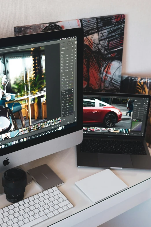 a desk with two monitors a keyboard and a laptop