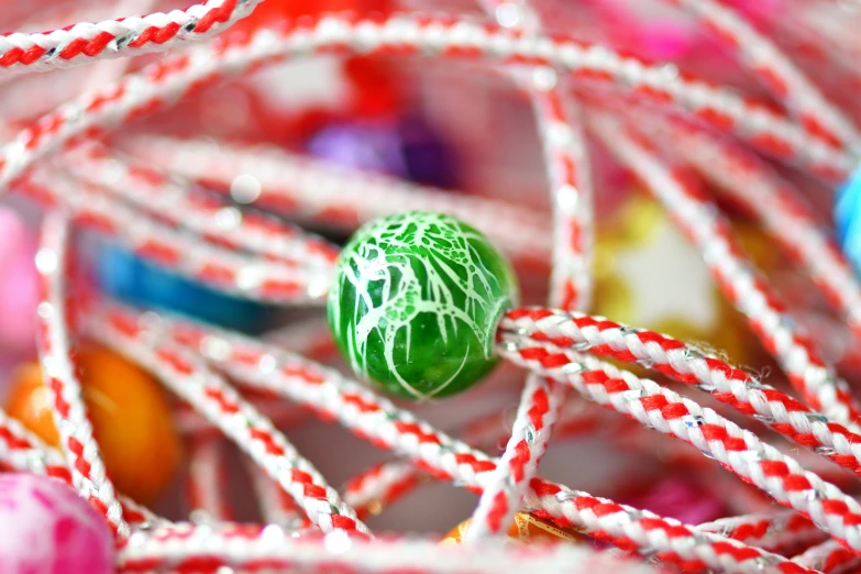 the colorful candies in the green and white candy are ready to be eaten