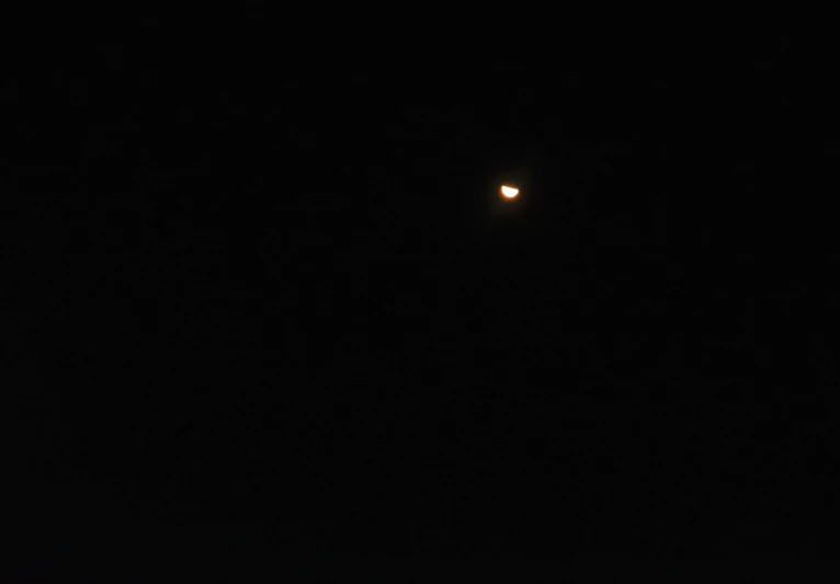 an object is flying in the air at night