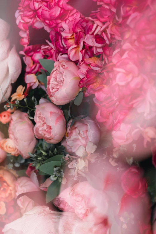 a bouquet of pink flowers sits on display