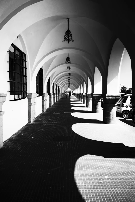 there is a large hallway with arches and archways