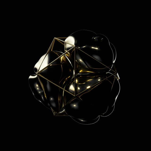 a gold object sitting in the dark on a black background