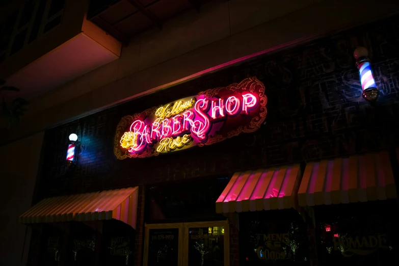 a store front with bright neon lights shines