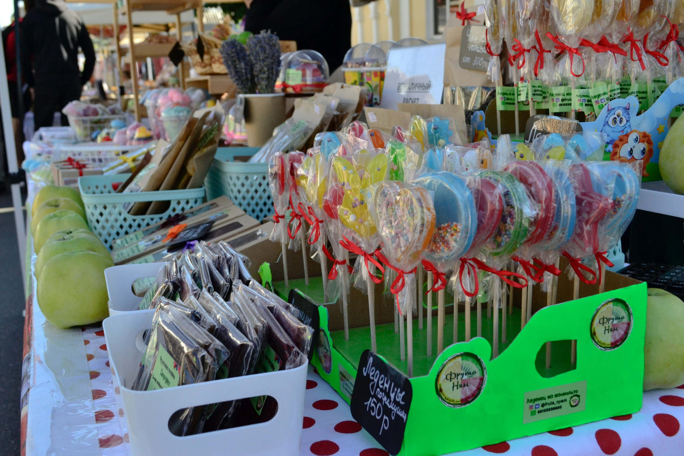 lots of lollipops on sticks sit together at the counter