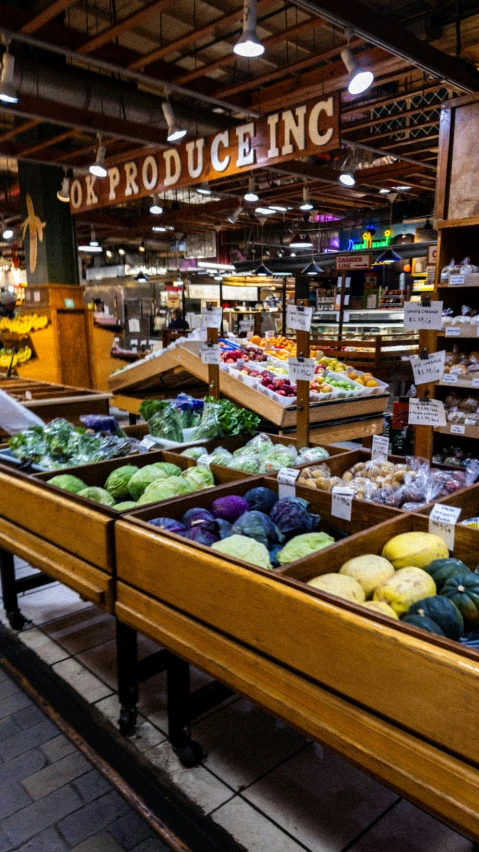 produce in bins in the middle of a market area