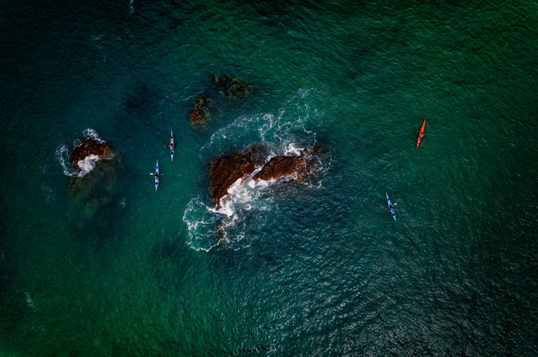 view of body of water from above with multiple boats