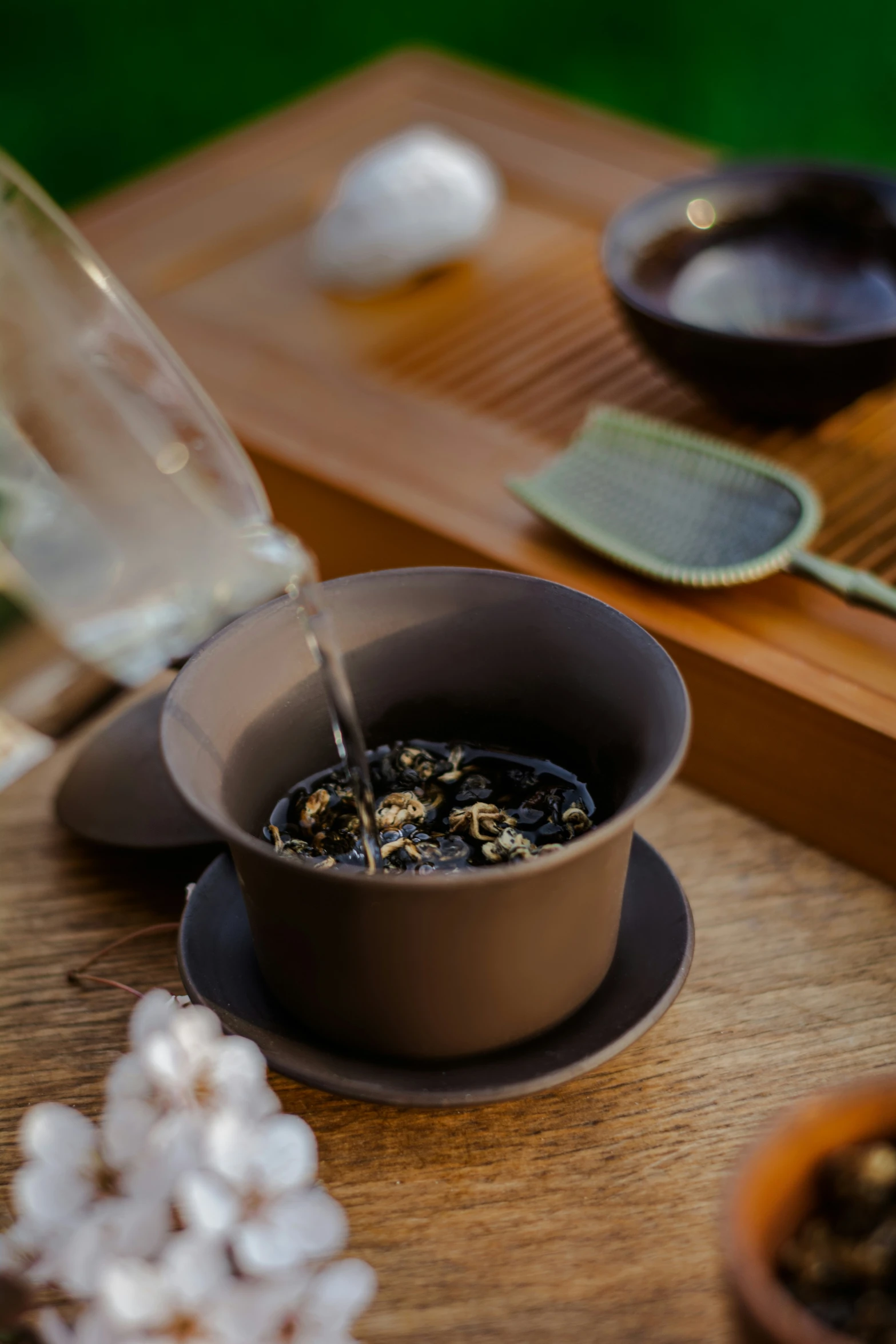 an image of tea being poured into a cup