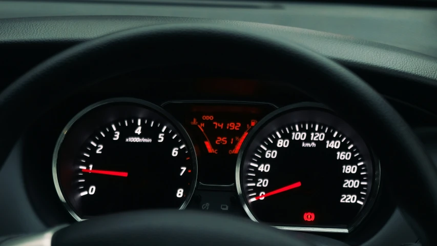 a dashboard with three instruments is shown with two orange arrows