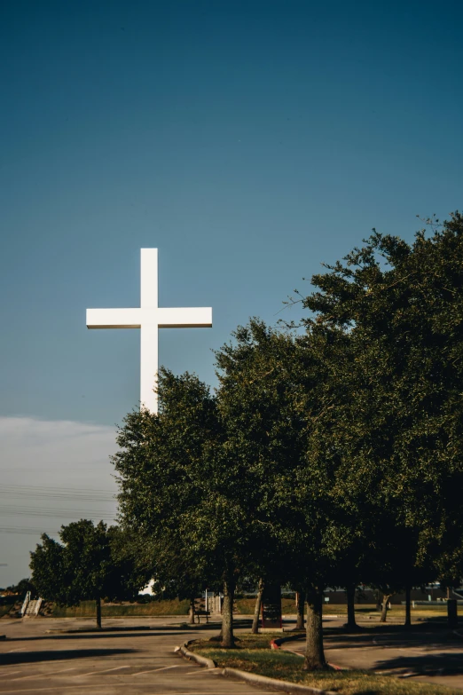 a very big cross in a grassy field