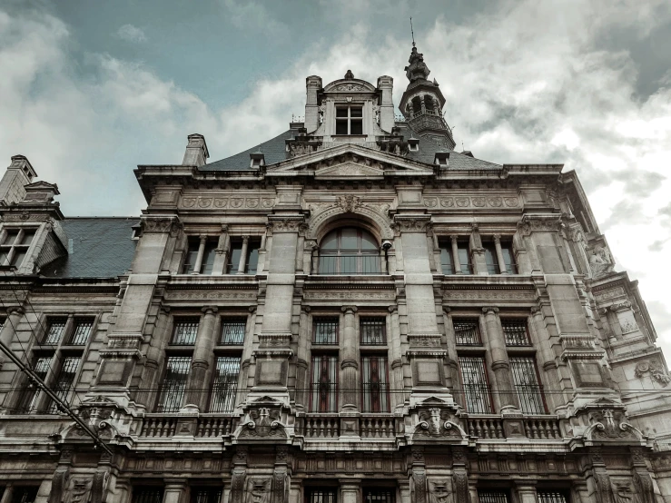 old, grey building on a cloudy day