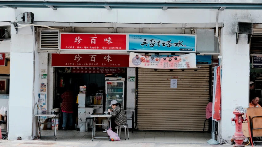 an oriental market with asian signs advertising it