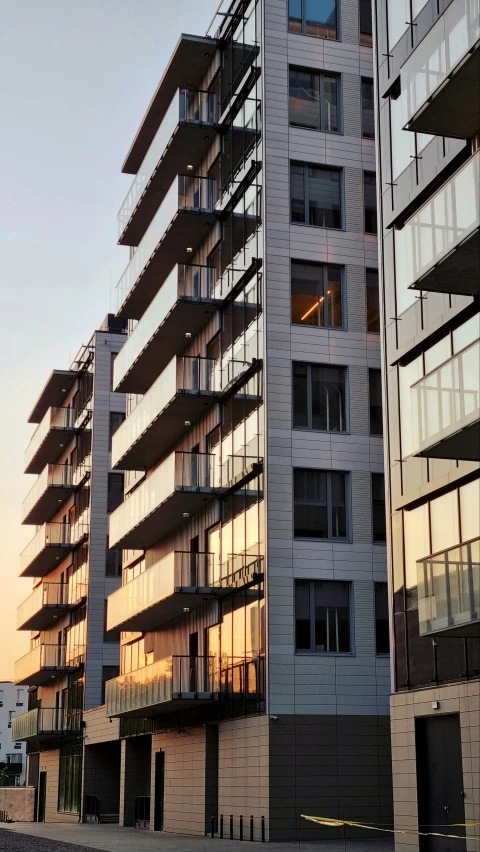 two buildings, one has the windows opened on either side