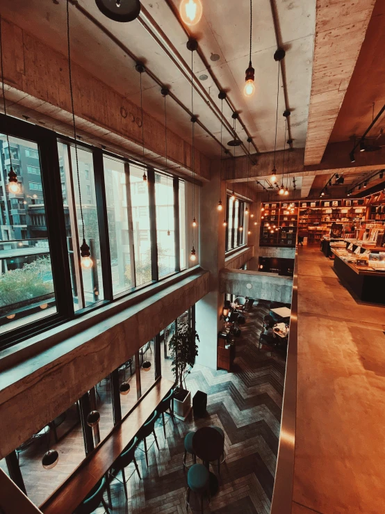 the inside of a bookstore with tables and chairs