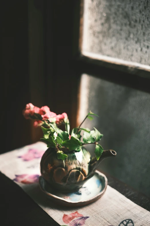 a small pot with some flowers in it