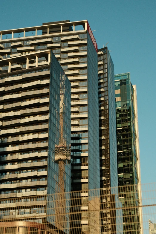 an urban city with many skyscrs reflected in windows