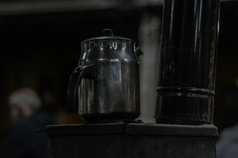 a coffee pot sits on top of an espresso machine