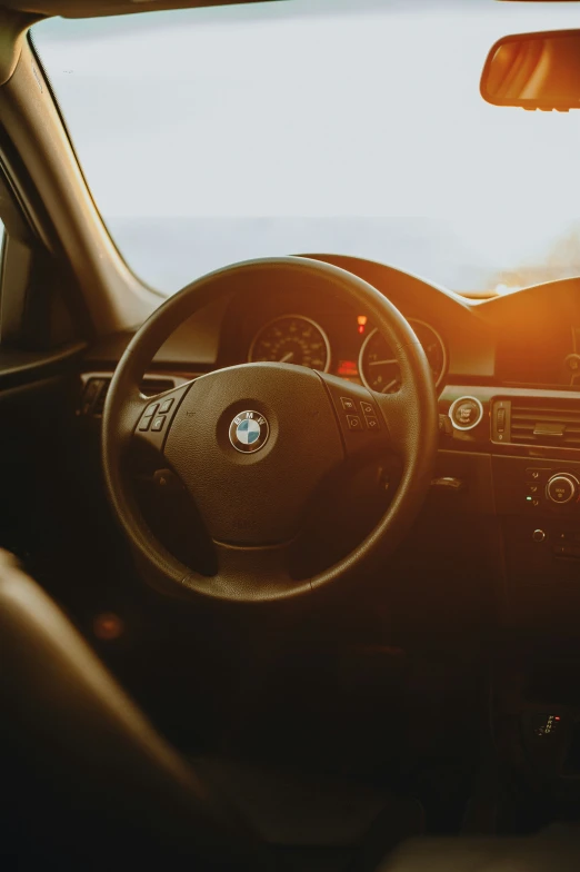 the view from inside a car at sunset