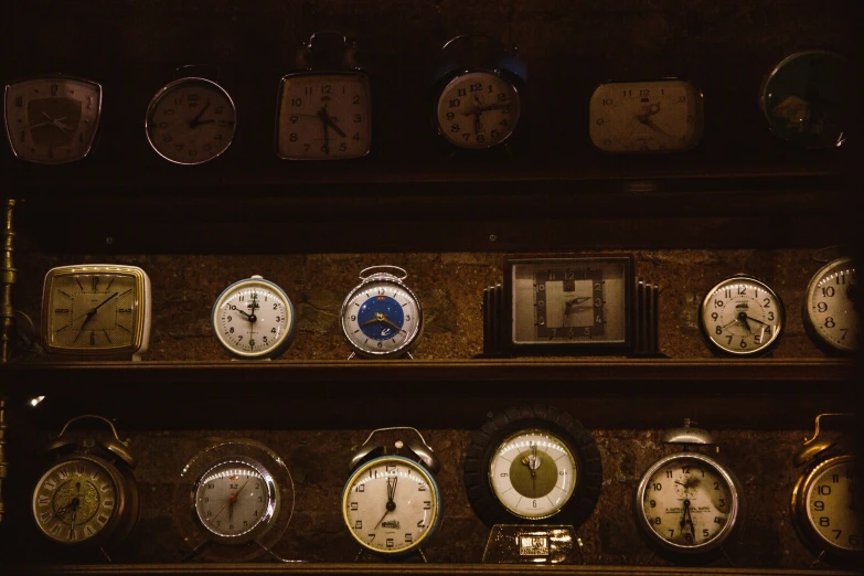 a wall full of clocks that include different times
