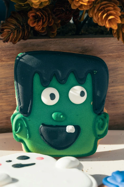 a fake green man that is on a table