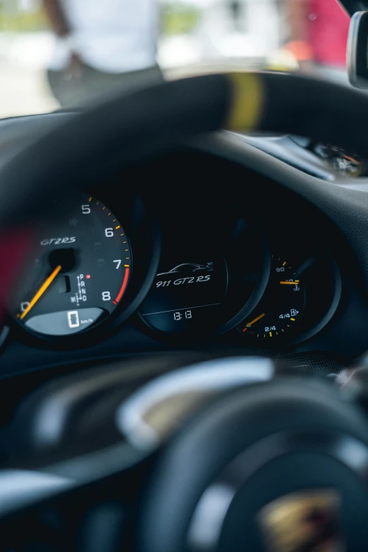 close up of a meter and gauges on a car dashboard