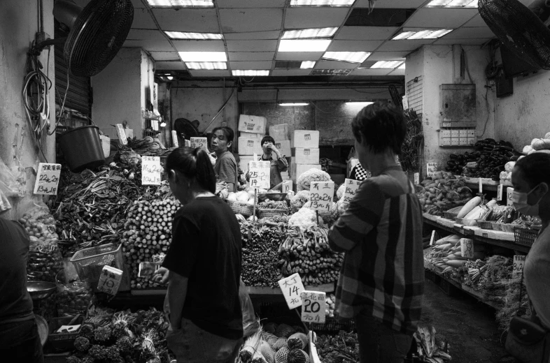 black and white po of customers at a store