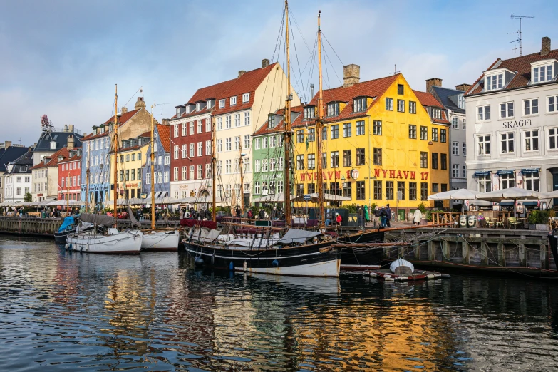 some buildings and boats on the water