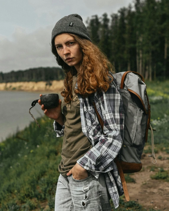 a hipster with a backpack and a camera