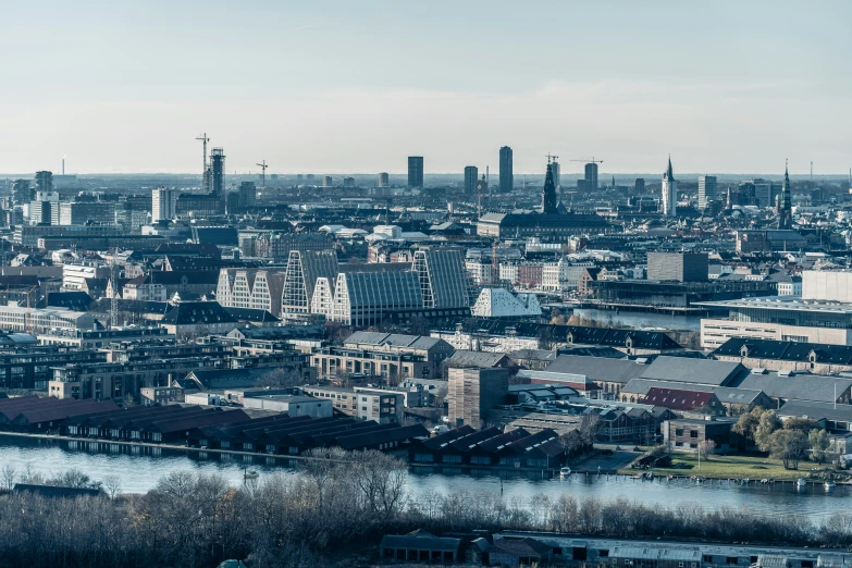 an overview of the city with a river in the foreground