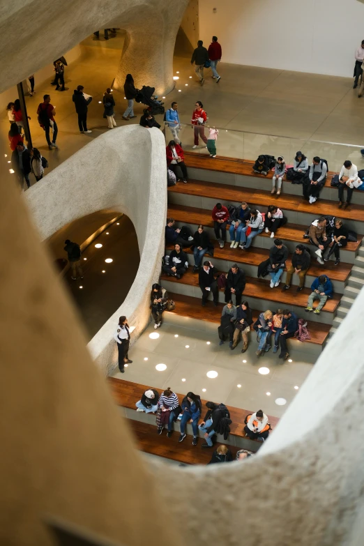 a very long and tall stair with people walking up it