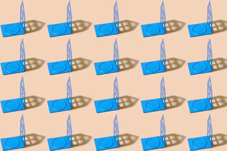 several rows of blue toothbrushes on top of each other