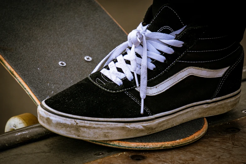 a man is standing on top of a skateboard